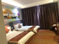 Q+ Nanxiong Xinhewan Business Hotel