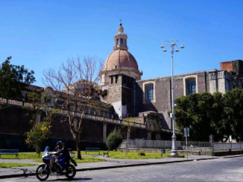 #winterescape Step into grandeur at the Benedictine Monastery of San Nicolò l’Arena, an absolute must-see in Catania! 🏛️✨ This UNESCO-listed landmark blends rich history, jaw-dropping architecture, and tranquil courtyards for a “hidden gem” vibe only minutes from the city buzz.

Kick off your visit by wandering the elegant cloisters and immersive halls—don’t miss the grand staircase, a truly insta-worthy angle where the light floods in dramatically. A guided tour is highly recommended to unlock fascinating secrets about the monks, their daily routines, and the monastery’s transformation over centuries. Pro tip: Ask about the underground passages; these offer a look at Catania’s layered history and are perfect for curious travelers.

Snap your best shots at the sunlit courtyards or with the ornate library backdrop. For relaxed photos, come early—before midday crowds gather near the entrance and Dante Square. The site’s peaceful atmosphere makes it ideal for slower exploration; linger in the tranquil gardens if you need a break.

Practical tips: The monastery is open year-round from 9:30 AM–5:00 PM, and entrance is from Piazza Dante Alighieri, 32. Wear comfy shoes; some areas have uneven floors. Bring cash for tickets and guided tours, as card payments aren’t always accepted. Be mindful: It’s still an academic institution, so stay respectful and stick to designated visitor areas.

For a seamless trip, combine the monastery visit with a stroll through nearby historic streets or a coffee at a Dante Square café—insider tip, the local pastries are delicious!

#Catania #Monastery #ItalyTravel #Heritage #HiddenGems