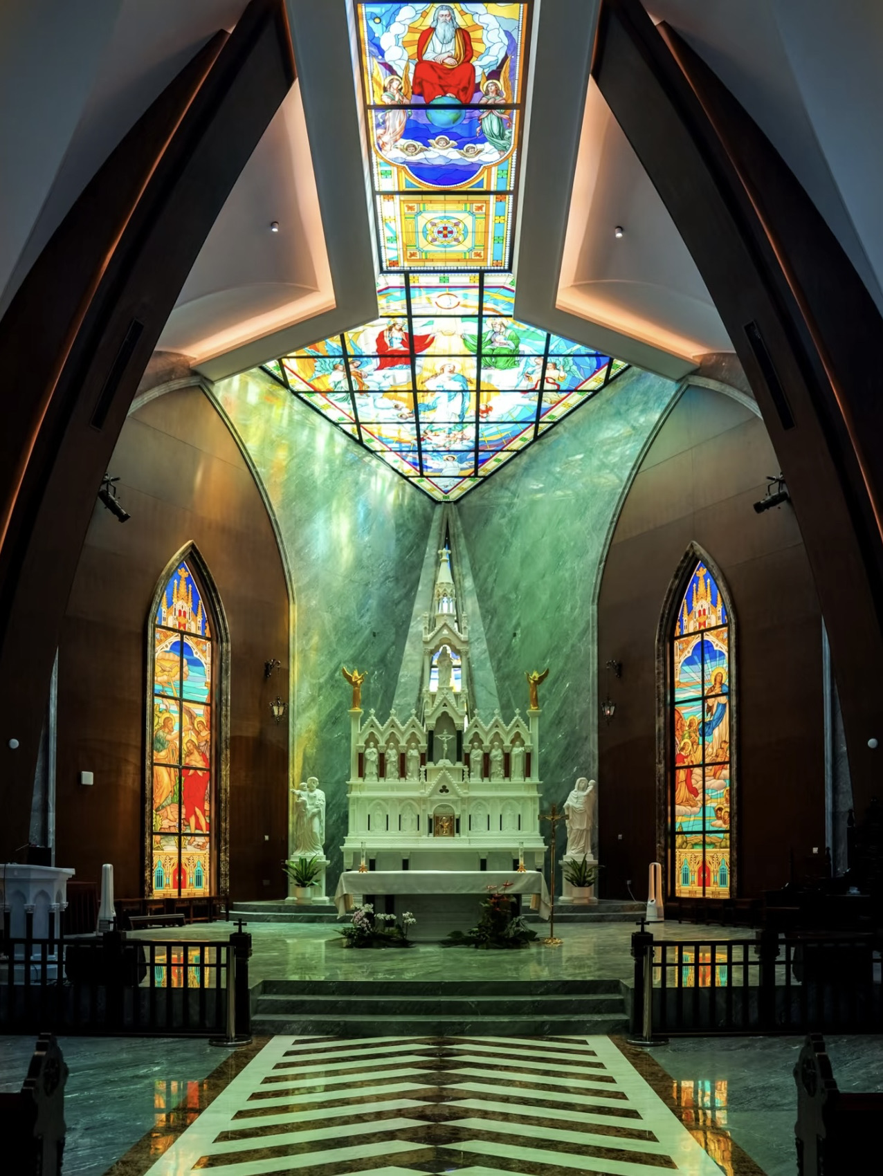 Okay, so get this: I heard there was a gorgeous church just south of Shanghai, so I packed up the car and set off early Sunday morning—road trip vibes! 🚗☀️ When I finally walked through those doors, my jaw basically hit the floor. All I could say was, “Wow!” No filter needed.

🕐Let’s talk basics first. This dreamy spot is the South Shanghai Catholic Church, open Monday to Saturday from 8:00 to 16:30 and Sunday until 17:00 (just a heads up, it’s closed during special events!). Thinking of driving? There’s parking right across from the church—super convenient. Pro tip: Leave your flash at home, since flash photography is a no-go inside.

🔥From the outside, this church is Insta-perfect. The red brick arches, epic stained glass windows, and that towering bell tower all scream modern Gothic vibes. Info on the place is kinda scarce, but if you wander the grassy square, you’ll spot a mysterious old stone tablet. According to the inscription, the Zhuangxing St. Francis Church was originally built in Xinhua Village way back in 1871. Over the years, parts were demolished for a school, then repurposed as a township office, and sadly, some spots were destroyed in 1975. Honestly, the connection between that building and today’s church is still a bit of a puzzle. 🕵️♂️

Inside, though? Absolutely breathtaking. Seriously, whoever designed this place was obsessed with light—and I love it! There’s an extra-long rose window of stained glass stretching east to west, creating a never-ending stream of rainbow light that fills the whole space. Pair that glow with the herringbone-patterned polished marble floors and the stunning rose windows on both sides, and you’ve got a church interior that is next level.

📍Since this location is a bit out there, why not make a day of it? Check out other nearby gems like Shen Family Garden, Yanzi Academy, Fengxian Museum, the iconic Shanghai Fish, or go chill in the Fengpu Four Seasons Ecological Park. You’ll get the ultimate culture trip—and totally max out your photo gallery. 🌿🎒

Seriously, if you’re into architecture, hidden gems, or just hunting for your new fave photo spot, the South Shanghai Catholic Church will blow you away. Add it to your Shanghai bucket list ASAP!

 #china #travel #travel2026 