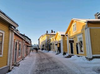 Day-tripping from Helsinki? Porvoo is the charming winter escape you didn’t know you needed ❄️🏘️ Just one hour from Helsinki by bus (departures about every 20 min), you’re instantly transported—from sleek city vibes to storybook scenery of pastel wooden houses and snowy streets.

Must-See: Porvoo Old Town
Location: 06100 Porvoo, Finland
Open: All day, year-round

Get lost among the iconic colored wooden homes and narrow cobblestone lanes—Porvoo Old Town is pure Finland magic. In winter, bundle up and walk *on the frozen river* for an unbeatable view of the picturesque town, especially at sunrise or sunset when the light hits those candy-hued facades. If you’re lucky, you’ll spot local kids playing in the snow with Porvoo as a gorgeous backdrop (seriously, it’s Instagram gold).

Travel Tips:
- Bus from Helsinki departs roughly every 20 minutes from the main bus station—no need to book ahead.
- Layers, winter boots, and gloves are a must if you want to enjoy the snow and maybe even venture onto the ice.
- Many cafes and shops in Porvoo Old Town are independent and super cozy. Try a pulla (Finnish cinnamon bread) and hot cocoa in any one of them for the ultimate warm-up!
- Easy day trip: first bus in the morning, last bus back in the evening = a perfect winter adventure.

Getting around is simple: the Old Town is best explored on foot, and everything is easily walkable once you hop off the bus.

#PorvooOldTown #HelsinkiDayTrip #WinterInFinland #TravelTips