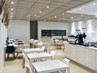 Minimalist cafe in almost all white decor in SS2
