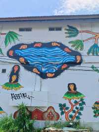 Citra Sasmita's enigmatic wall art at the Bali Kuta bus station.