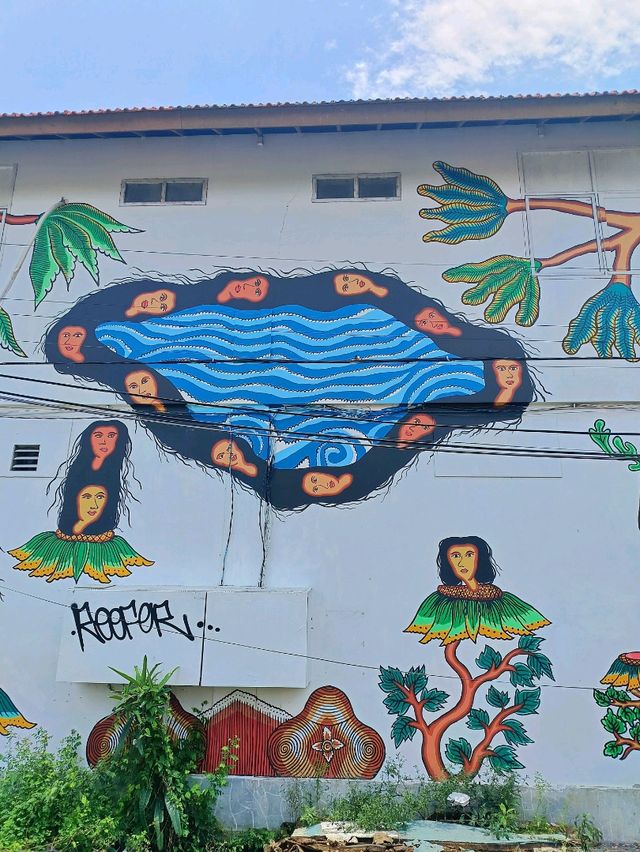 Citra Sasmita's enigmatic wall art at the Bali Kuta bus station.