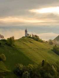 ⛪✨ “Heaven on a Hill: My Sunrise at Jamnik Church” 🌄📸