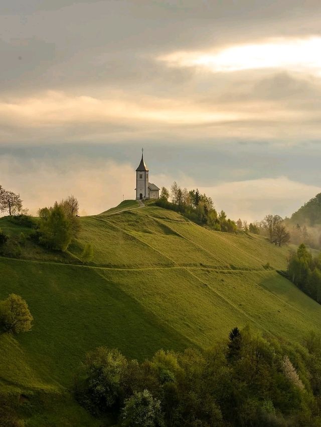 ⛪✨ “Heaven on a Hill: My Sunrise at Jamnik Church” 🌄📸