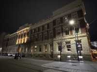 Artist city w colorful lights illuminating old buildings 