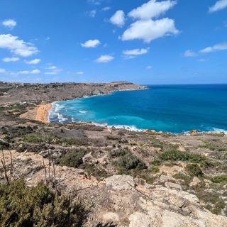 Golden Shores and Calm Waves at Ramla Bay