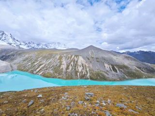 Walking by the mystical lakes of Tibet and admiring the snow-capped mountains.