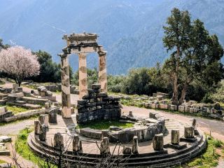 #unforgettabletravelexperiences

Located about three hours from Athens (Greece) is Delphi. A fabulous ancient city that is fairly well persevered. This historically significant archaeological site is now run by the Greek government. 

Delphi was considered 'the naval of the earth', by the ancient greeks. It is situated high above a deep valley and nestled below steep orange cliffs in a stunning position. The site has some iconic and nicely reconstructed buildings; The Temple of Apollo, The Ancient Theatre, The Stadium, and The Sanctuary of Athena Pronaia.

One thing that motivated me to visit here were the tales about the Delphi Oracle or the High Priestess. In the Temple of Apollo she provided prophecies while she was in a trance. There were many different Oracles through the centuries and Delphi prosperity grew because of them. People from all over Greece come seeking answers to complex problems.

The one thing I did not know about this ancient city before I visited was the Athletics Stadium. This is a huge site that could seat 7000 people and it is built high on the hill hidden behind a small ridge. Here they held Great athletic games.

I think the best preserved structure is the Ancient Theater with its many seats which look down the valley and across to the hallowed mountains.

#delphioracle #greece #ruins #europetrip 