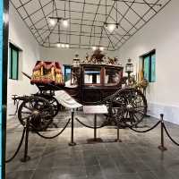 A museum filled with coaches on exhibits
