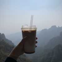 Drinking iced latte on top of Baishi Mountain