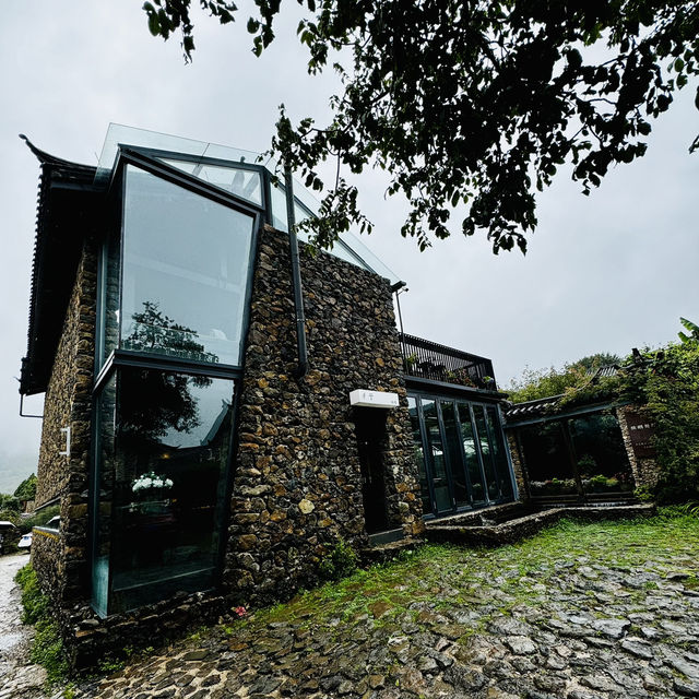 Quaint stone village under Yulong Mountains