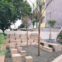 THERE ARE OUTDOOR AREAS AROUND IT FRONT, SIDE, AND BACK