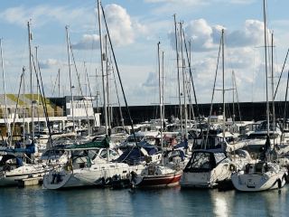 Stroll along Brighton Marina, admire the yachts, and enjoy the seaside lawn.