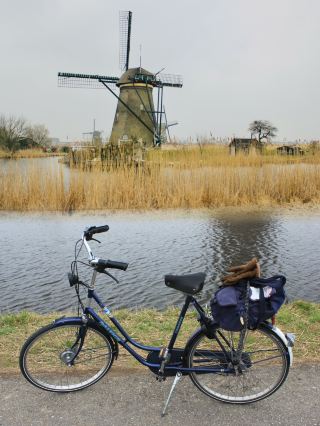 Serenity in Motion: Cycling Through Kinderdijk on a Gloomy Spring Day