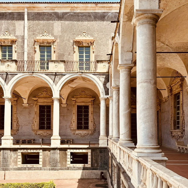 A Solo Traveller’s Retreat: Benedictine Monastery of San Nicolò l’Arena** 🏰