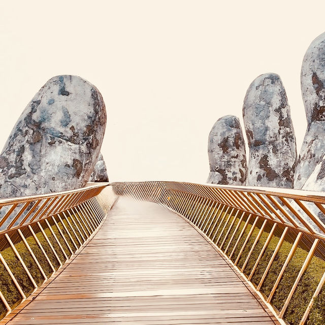 🌉✨ *Golden Bridge (Cầu Vàng): Vietnam’s Giant Hands Holding a Gilded Pathway* 🏞️🌿