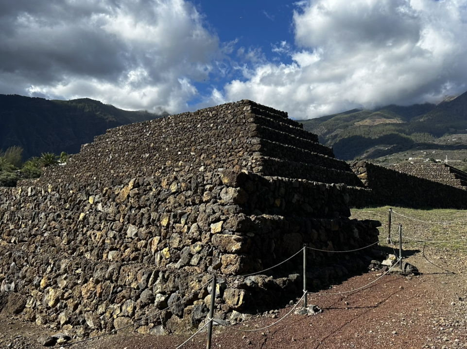 Step Into History at the Pyramids of Güímar ☀️🏞️  
Discover mysterious terraced pyramids amid sun-drenched landscapes at the Pyramids of Güímar—an open-air museum blending ruins, nature, and hands-on fun! This is the perfect spot for curious minds, families, and anyone seeking an easy-yet-informative adventure under the Canarian sky.

Stroll through accessible paths lined with leafy trees and unique volcanic stonework. The stroller-friendly layout means kids and parents can roam easily, and there’s even a small playground for little ones to unwind after touring the ruins. Start at the handy visitor center to pick up a map and learn the pyramids' quirky theories—from ancient transit routes to ceremonial sites.

Must-dos:
· Explore the six stepped pyramids, pausing at interpretive panels for bite-sized history
· Wander the ethnobotanical garden for vivid views and cool shade
· Visit the Exhibition Hall to dive into Tenerife’s archaeological past

Top photo spots:
· Capture the classic pyramid panorama from the garden’s main vista point (look for sun-dappled palm silhouettes)
· Snap shots near the striking lava-stone walls and cactus clusters

Tips:
· Open year-round, 10:00–18:00, so you can avoid midday heat by visiting early or late
· Bring water and sunblock—the site is mostly outdoors with limited shade
· Let kids blow off steam at the small playground while adults check out the exhibits

Precautions:  
Paths are stroller-friendly, but some gravel sections may be bumpy—wear comfy shoes and watch toddler toes. Keep an eye on little ones around historic structures.

#Guimar #PyramidsofGuimar #FamilyTravel #OutdoorAdventure #SpainRuins