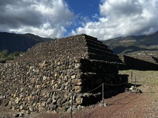 Step Into History at the Pyramids of Güímar ☀️🏞️  
Discover mysterious terraced pyramids amid sun-drenched landscapes at the Pyramids of Güímar—an open-air museum blending ruins, nature, and hands-on fun! This is the perfect spot for curious minds, families, and anyone seeking an easy-yet-informative adventure under the Canarian sky.

Stroll through accessible paths lined with leafy trees and unique volcanic stonework. The stroller-friendly layout means kids and parents can roam easily, and there’s even a small playground for little ones to unwind after touring the ruins. Start at the handy visitor center to pick up a map and learn the pyramids' quirky theories—from ancient transit routes to ceremonial sites.

Must-dos:
- Explore the six stepped pyramids, pausing at interpretive panels for bite-sized history
- Wander the ethnobotanical garden for vivid views and cool shade
- Visit the Exhibition Hall to dive into Tenerife’s archaeological past

Top photo spots:
- Capture the classic pyramid panorama from the garden’s main vista point (look for sun-dappled palm silhouettes)
- Snap shots near the striking lava-stone walls and cactus clusters

Tips:
- Open year-round, 10:00–18:00, so you can avoid midday heat by visiting early or late
- Bring water and sunblock—the site is mostly outdoors with limited shade
- Let kids blow off steam at the small playground while adults check out the exhibits

Precautions:  
Paths are stroller-friendly, but some gravel sections may be bumpy—wear comfy shoes and watch toddler toes. Keep an eye on little ones around historic structures.

#Guimar #PyramidsofGuimar #FamilyTravel #OutdoorAdventure #SpainRuins