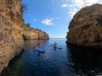 Paddleboarding and cliff jumping at secret caves in Ibiza