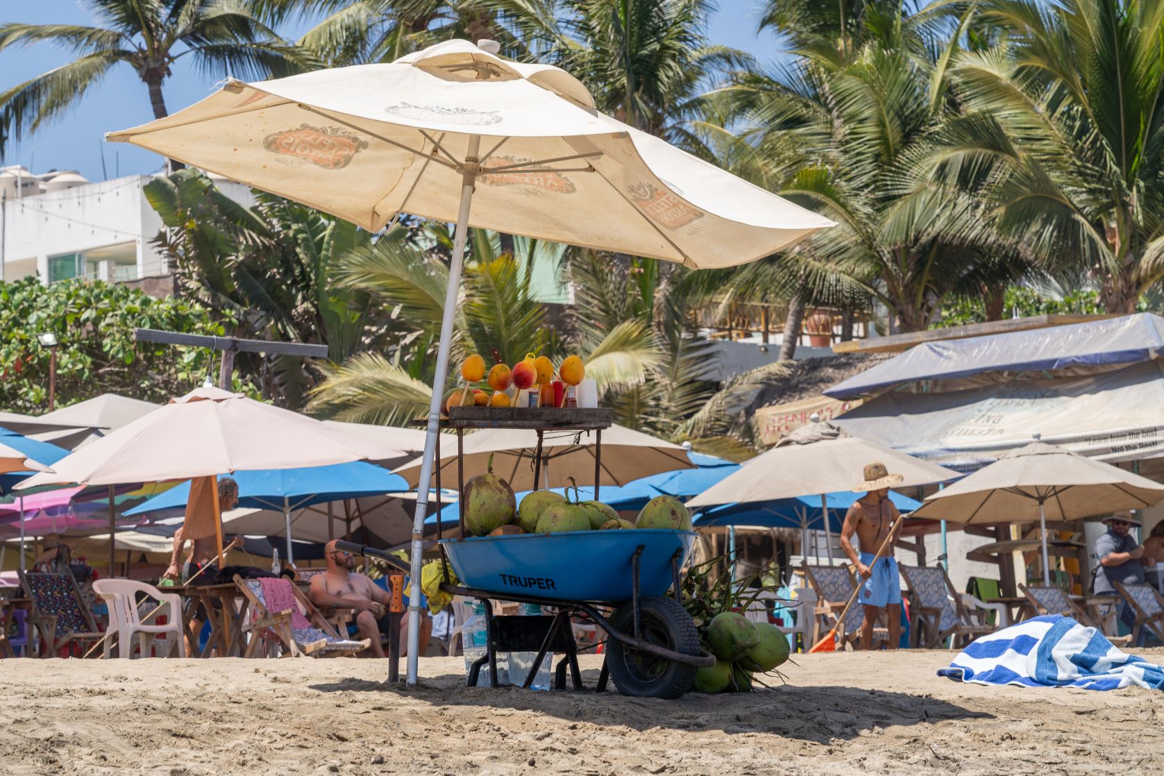 Beach Umbrellas, Plaza Color, Hats, and Handicrafts Around Carricitos