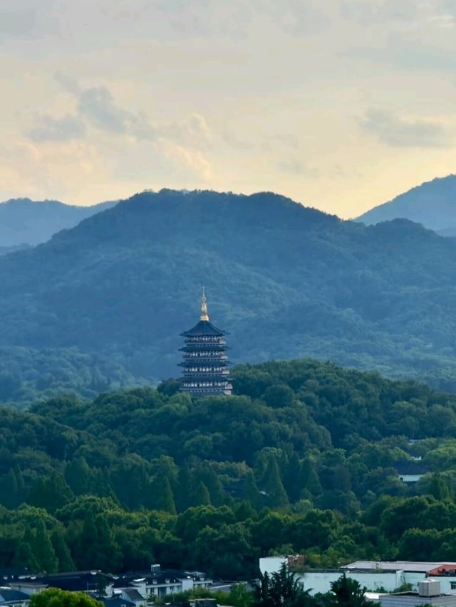 Where Wu Hill's Winds Embrace Centuries, One Tower Captures Hangzhou's Soul