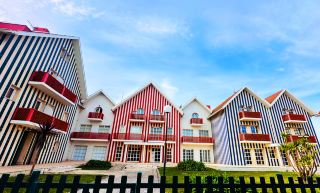 A slow travel guide to Portugal's hidden coast of colorful wooden houses