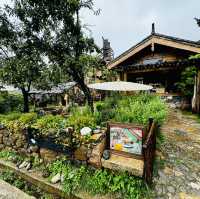 Quaint stone village under Yulong Mountains