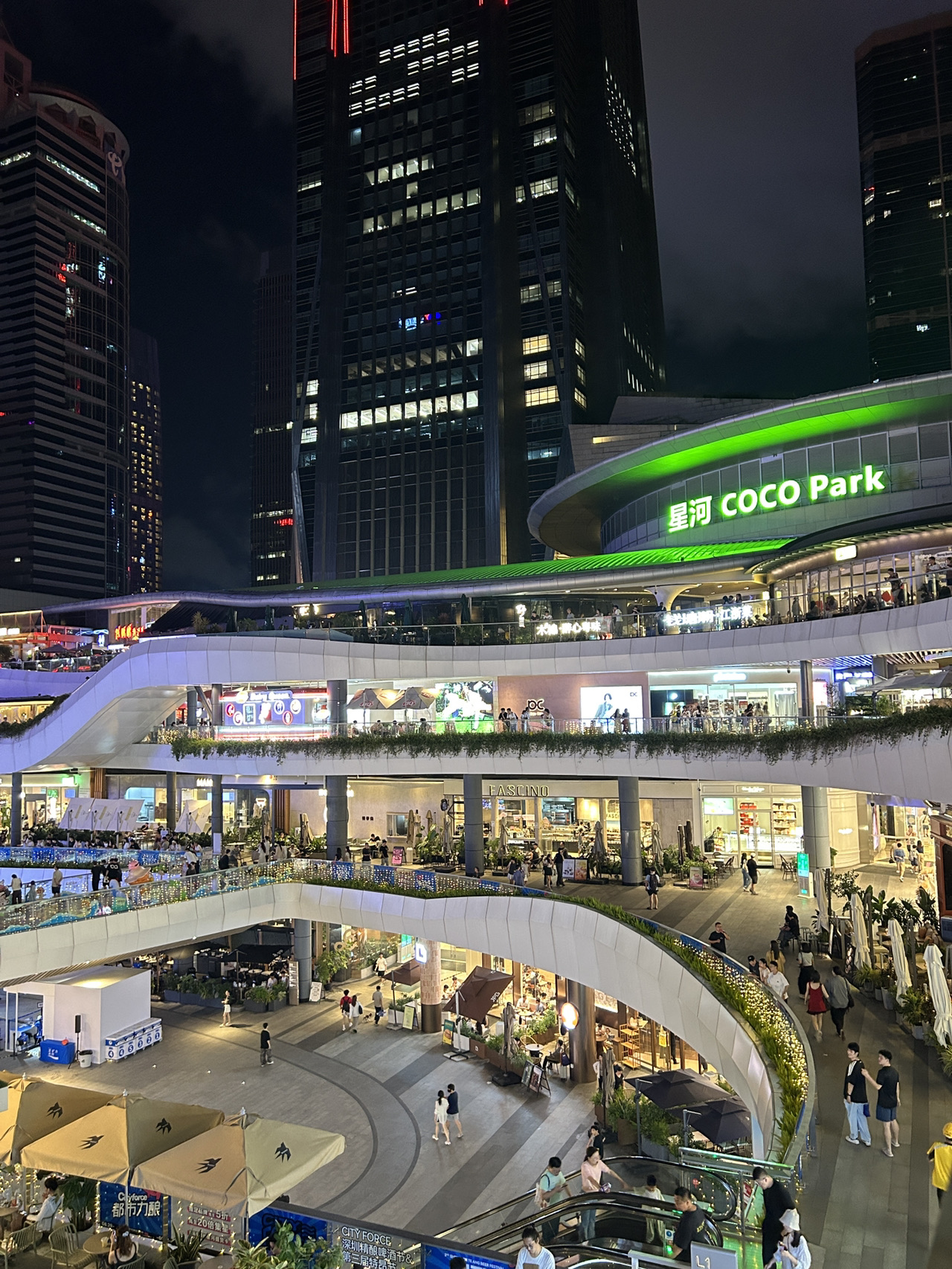 🛍️ Shenzhen in one night? COCO Park is where the action’s at! If you’re all about shopping, modern vibes, and food exploration—this mega mall is your go-to spot for mixing retail therapy with tasty bites.

Top Spots to Visit at COCO Park:
- COCO Park Shopping Mall (3099 Shennan Ave, Futian District, Shenzhen, open till 10 PM) is packed with global brands, indie stores, and cool pop-ups. Big mall = lots of shopping options!
- Hit the outdoor cultural landscape area 🏙️, especially after dark for a modern cityscape buzz and neon-lit photo ops.
- Check out their indoor dining zone for food galore: I grabbed bowls of noodles and legit side dishes at a cozy restaurant—so many tasty options around, from quick bites to fancier dessert spots.

Pro Tips:
- Go at night for peak atmosphere—modern architecture looks awesome lit up, and the park comes alive.
- Wear comfy shoes! This place is huge and you’ll be pounding the pavement if you want to shop everywhere.
- If you’re hungry, try local noodle spots inside the mall for an authentic Shenzhen flavor fix 🍜.
- Most shops accept cards, but Alipay/WeChat Pay is super convenient here.

Getting Around:
- Best way: Metro Line 1 to Shopping Park Station (exit D lands you right by COCO Park).
- Taxis and rideshare are easy but traffic can get wild so time your trips smart.

#ShenzhenNights #COCOParkGuide #ChinaShopping #FoodieFinds #thingstodo 