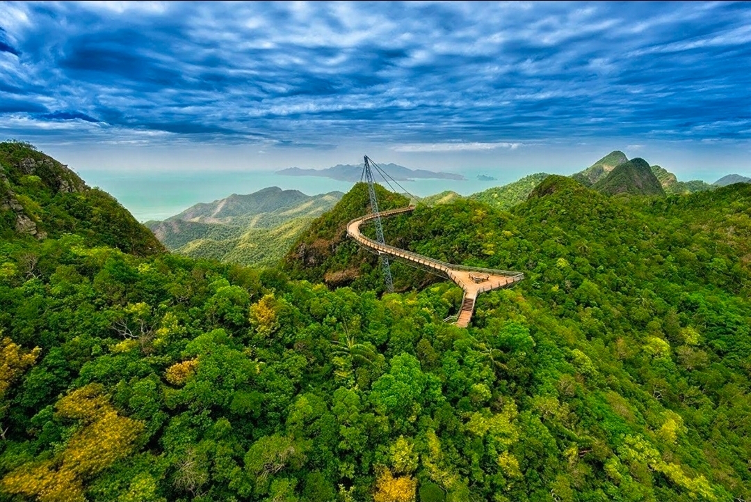 🌉 Langkawi Sky Bridge, Malaysia 🇲🇾 — A Walk Above the Clouds

Imagine walking high above the lush green mountains, surrounded by breathtaking views of turquoise waters, tropical forests, and distant islands. 💚🌊 Welcome to Langkawi Sky Bridge, one of Malaysia’s most spectacular attractions!

Suspended high above the rainforest on Mount Mat Cincang, this stunning curved pedestrian bridge offers panoramic views of Langkawi’s natural beauty and the Andaman Sea. Every turn reveals a picture-perfect landscape, making it a dream destination for nature lovers, photographers, and adventure seekers.

The journey to the bridge is an experience in itself, with a scenic cable car ride offering incredible aerial views of the mountains and coastline. On a clear day, the scenery is simply unforgettable. ☁️✨

If you’re planning a trip to Malaysia, add Langkawi Sky Bridge to your bucket list. Sometimes, the most beautiful views are found above the clouds! 💙

📍 Location: Langkawi Sky Bridge, Kedah, Malaysia

#Langkawi  #LangkawiSkyBridge  #MalaysiaTravel  #VisitMalaysia  #TravelPhotography  #BeautifulDestinations  #NatureLovers  #TravelTheWorld  #TripMoments #naturalwonders #travel2026 