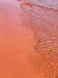Red Sand Beach: Spring’s Crimson Canvas