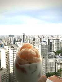 Try home made breakfast on top floor of iconic vintage building of copan with Sao Paulo skyline view