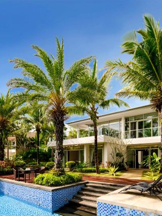 The hidden villa weaves a vacation vibe into its acrylic aesthetic space
