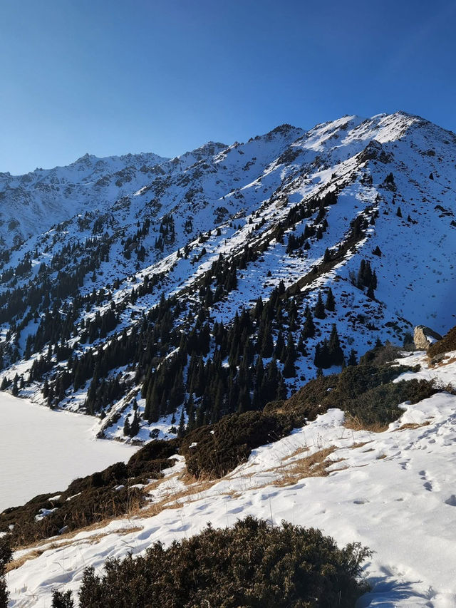 Still waters, snowy peaks, and silence