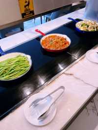 “Delicious Variety at Evolution Cafe’s Buffet”