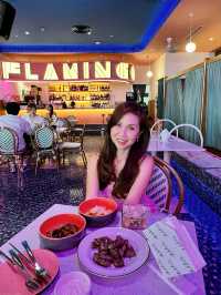 Neon-pink poolside bar-themed restaurant! 🦩💕