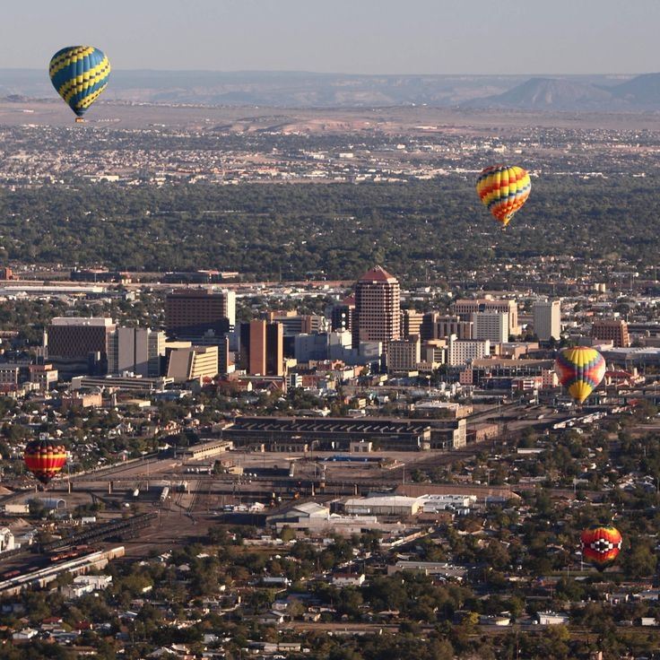 I recently spent a couple of days in Albuquerque, New Mexico. Coming from humid Hong Kong, the dry, thin air here at 1,600 metres was a real system shock—I had to double my water intake and apply lip balm constantly. But as someone who works in exhibition curation, the museums and historical spots here were incredibly fascinating, and the retro aesthetic of the city felt surprisingly nostalgic.

Here is a detailed breakdown of how I spent my two days, mostly getting around by rideshares.

· *Day 1: Balloon History, Pueblo Art & Retro Neon**
I started around 8:40 AM, taking a 20-minute Uber from my hotel near Old Town to the Anderson-Abruzzo Albuquerque International Balloon Museum (entry was USD 7). Being a curation assistant, I really appreciated how they laid out the history of hot air balloons and early flight gear. It wasn’t crowded on a Thursday morning, so I could take my time browsing the vintage baskets and historical footage.

By late morning, I headed to Old Town to see the historic adobe buildings and the San Felipe de Neri Church. It has a very distinct Spanish-Pueblo charm, though the tourist crowds were starting to build up. Afterward, I visited the Indian Pueblo Cultural Center (USD 12). If you go, definitely plan to have lunch at their on-site restaurant. I tried the local dishes featuring their famous red and green chilies—quite spicy but very unique. The restaurant gets busy, so prepare to wait a bit for a table.

In the afternoon, I stopped by the New Mexico Museum of Natural History and Science (USD 14) to see the dinosaur fossils, before heading to Nob Hill along Route 66 for sunset. The vintage neon signs lighting up at dusk had this amazing, nostalgic late-80s aesthetic. It honestly felt like stepping into a scene from *Cowboy Bebop* or some classic retro sci-fi anime.

· *Day 2: Volcanic Rocks, Cold War History & A Windy Mountain Peak**
I started early at 8:15 AM to beat the sun, taking an Uber to the Petroglyph National Monument (Piedras Marcadas Canyon). Walking among the black volcanic rocks to spot the ancient petroglyphs carved by Native Americans and early Spanish settlers was incredibly peaceful. Just a heads up: there are absolutely no shops or shade along the trail, so you must bring your own water.

Next was the National Museum of Nuclear Science & History (USD 22). The exhibition on the Manhattan Project and Cold War technology was deeply fascinating, if a bit sobering. Seeing the decommissioned bomber planes and rockets in the outdoor exhibition area reminded me of the post-apocalyptic settings in some of the sci-fi anime and mobile games I play at home.

The highlight of the afternoon was the Sandia Peak Tramway (USD 35 for a round trip). It takes about 30 minutes to get there from the city. The cable car takes you up to over 3,200 metres. A word of warning: the weather at the top is completely different from the city. It was incredibly windy and easily 10 to 15 degrees colder. I was shivering in my light jacket, so definitely pack a proper windbreaker. Also, check their website before going, as they close for maintenance on Tuesdays or when the winds are too strong.

· *Some practical details if you’re planning a trip:**
· **Transportation:** I relied on Uber. It's doable, but since the spots are quite spread out (especially the Tramway and the Nuclear Museum), expect to wait 5–10 minutes for a ride to accept. If you can drive, renting a car might save you some waiting time.
· **Altitude & Weather:** Drink water constantly. The sun is intense, and the air is very dry. 
· **Closures:** Keep in mind that some places have specific rest days (like the Balloon Museum on Mondays, and the Tramway usually on Tuesdays). Plan your itinerary carefully so you don't end up facing closed doors.

It was a relatively quiet, low-key trip, but the unique blend of desert nature and retro-futuristic history made it well worth the long flight.