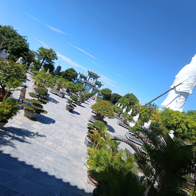 Peace and tranquility beside a giant Buddha.