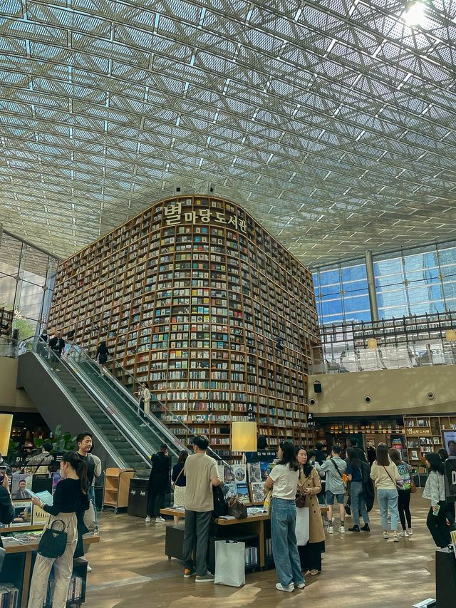 Lost in thought, surrounded by books