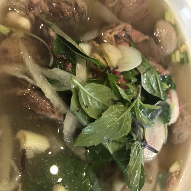 Hot pho (Vietnamese noodles soup) in a cold snowy day