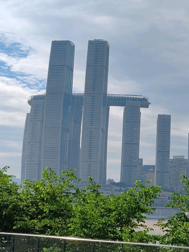 Doughnut Frames the Skyline: A Sweet Urban Snapshot