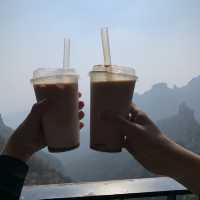 Drinking iced latte on top of Baishi Mountain