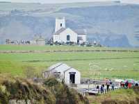 April in Ballintoy: A Coastal Church Scene