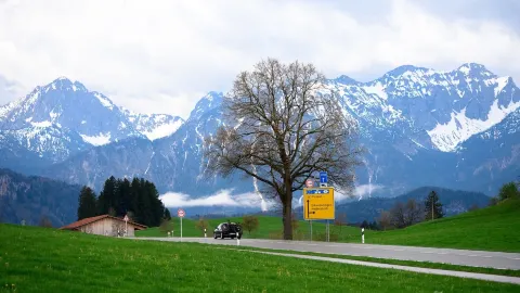 Discover the hidden gem of Füssen, a romantic town nestled in the embrace of the Alps amidst lush green meadows. — traveler post in Fussen