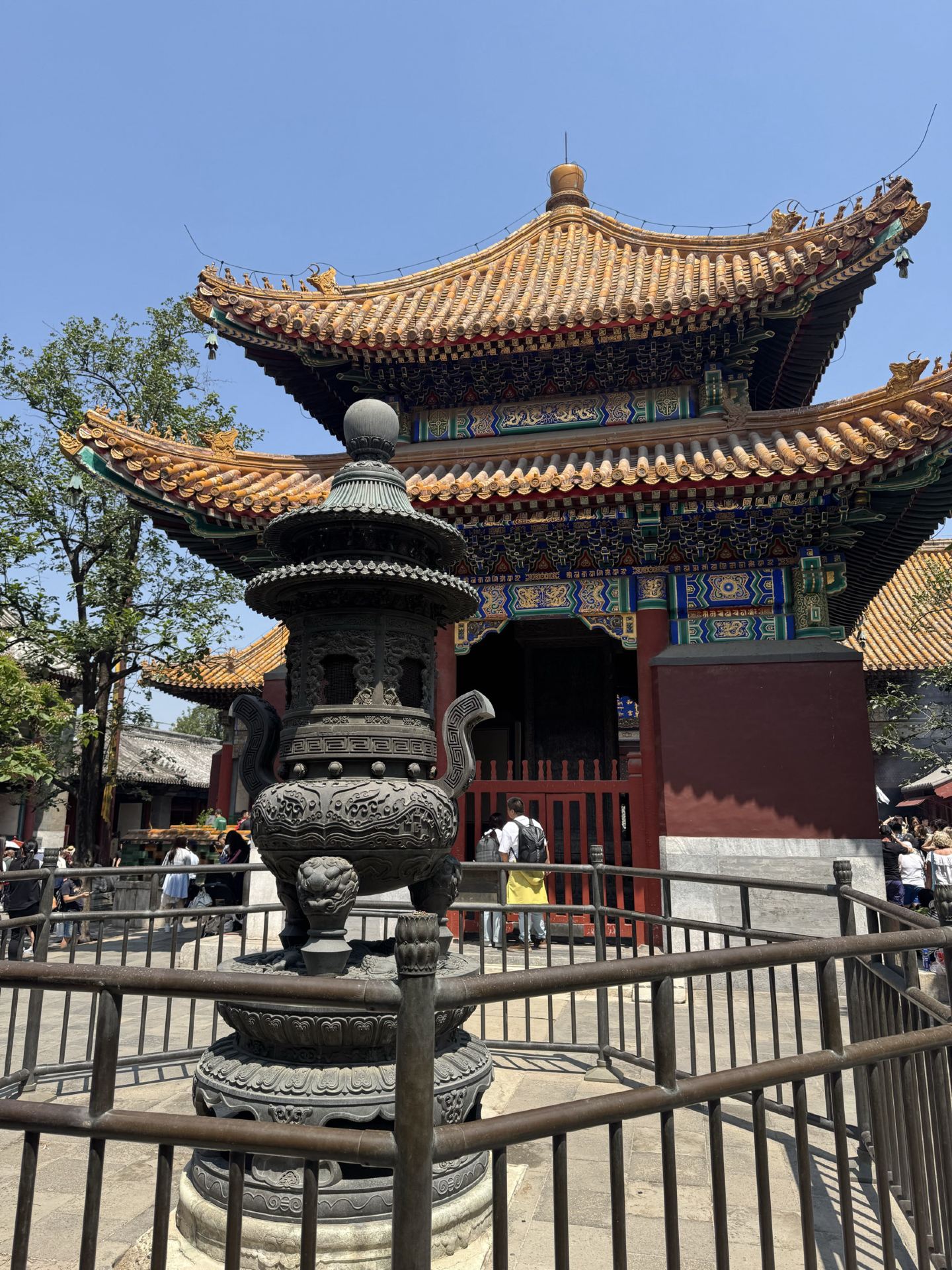 This is hands-down one of the most stunning temples I’ve ever visited in China. It’s an atmospheric, powerful, and truly vibrant place. We arrived around 11:00 AM, and it absolutely blew us away.

🕯️ What is this place?

The Yonghegong Temple (Lama Temple) is the largest and best-preserved Tibetan Buddhist monastery in the heart of Beijing. Originally built in 1694 as a prince’s residence, it was converted into an imperial monastery in 1744. Today, it’s not just a museum but a living temple where hundreds of worshippers gather daily. 

Outside of Tibet, it is also widely known as the Lama Temple.

✨ Architecture: A unique fusion of Chinese, Tibetan, and Manchu styles. The golden roofs, intricate carvings, and massive Buddha statues are absolutely mesmerizing.

The highlight is the world’s largest Buddha statue carved from a single piece of sandalwood—standing at a staggering 18 meters tall, it is truly breathtaking.

Many people come here to pray rather than just sightsee. Watching them light incense and chant mantras makes you realize this isn’t just a tourist spot; it’s a place of deep spiritual significance.

🙌 Logistics: We arrived at 11:00 AM and bought tickets at the entrance with no wait. The price is 25 RMB. Make sure to bring your passport, as it’s required for entry.

While it was fairly crowded with both tourists and worshippers, the crowd didn’t take away from the experience; if anything, it added to the sacred atmosphere.

⏰ How much time do you need?

We spent about 40 minutes there. You could easily stay longer if you want to examine every detail, but 40 minutes was enough for us to soak in the vibes and see the main highlights.

💡 Our top tips:

Arrive early: The temple opens at 9:00 AM, and the morning light is perfect for photography.

Bring your passport: You can’t buy a ticket without it.

Be respectful: This is an active place of worship. Keep noise levels down and stay out of restricted areas.

Bring cash or use Alipay: The ticket office may not accept international cards.

Dress appropriately: Keep your shoulders and knees covered.

Don’t miss the entrance: The main gate with its three arches is a great photo op.

📍 How to get there:
Take Metro Line 2 or 5 to Yonghegong Lama Temple station, Exit F. It’s just a 2-minute walk from there.

Yonghegong is a must-see, even if you’ve seen plenty of other temples in China. It’s unique, vibrant, and authentic. We left feeling uplifted and moved. Don’t miss out! 🙏✨
