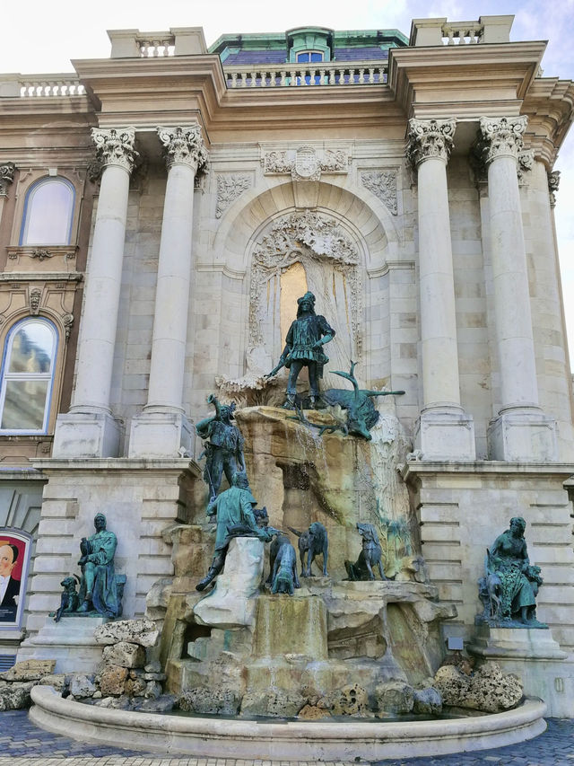  From Stone Turrets to Falling Legends: A Golden Hour at Matthias Fountain