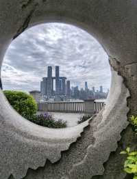 Doughnut Frames the Skyline: A Sweet Urban Snapshot