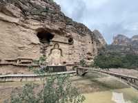 A 1600-year-old site on Yellow River with 183 caves and niches, 694 stone statues