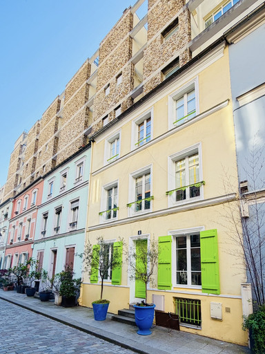 🌈 This street has houses all in pastel colors 🌈 in Paris. | Trip