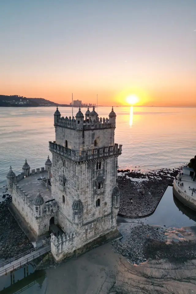 Lisbon runs into the medieval dusk under the Belem Tower